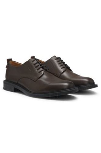 Chaussures derby en cuir avec logo en relief - HUGO - Modalova