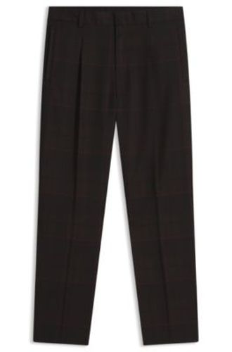 Pantalon Slim en laine vierge à carreaux emblématiques de la maison - HUGO - Modalova