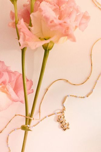 Collier superposé à fleur de naissance plaqué or par - By Anthropologie - Modalova