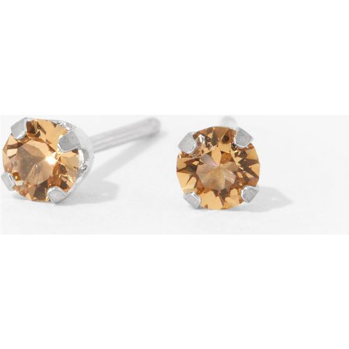 Kit de piercing pour les oreilles avec clous d’oreilles ornés de cristaux couleur topaze clair novembre 3 mm en or 9 carats au fini rhodié avec lo - Claire's - Modalova