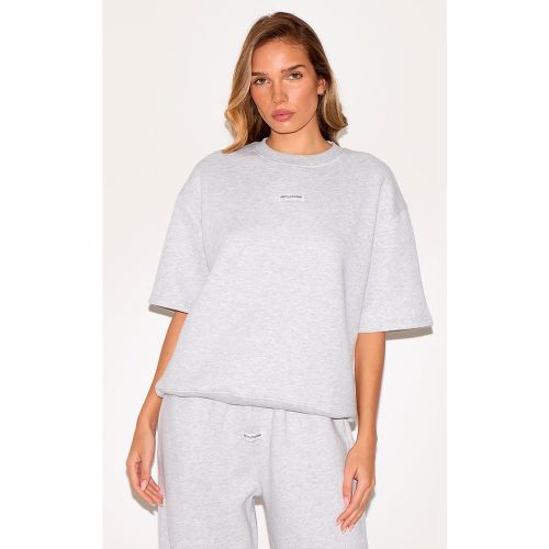 T-shirt oversize à détail badge et manches courtes - PrettyLittleThing - Modalova