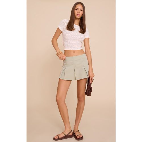 Jupe-short de tailleur patineuse tissée à plis creux - PrettyLittleThing - Modalova