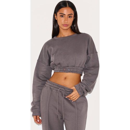 Petite Top court en sweat à ourlet élastique - PrettyLittleThing - Modalova