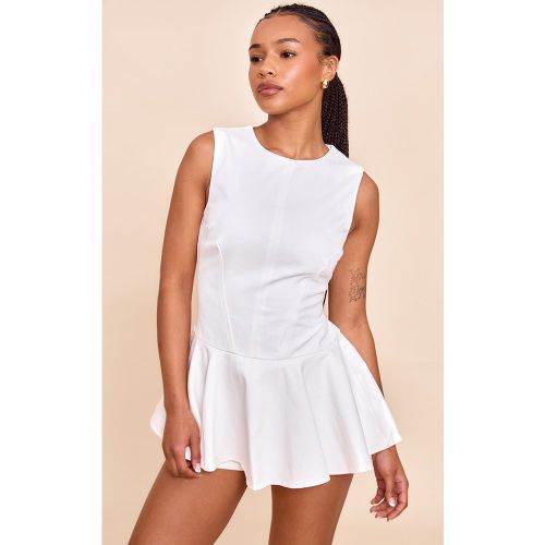 Petite Combishort jupe-short péplum en coton - PrettyLittleThing - Modalova