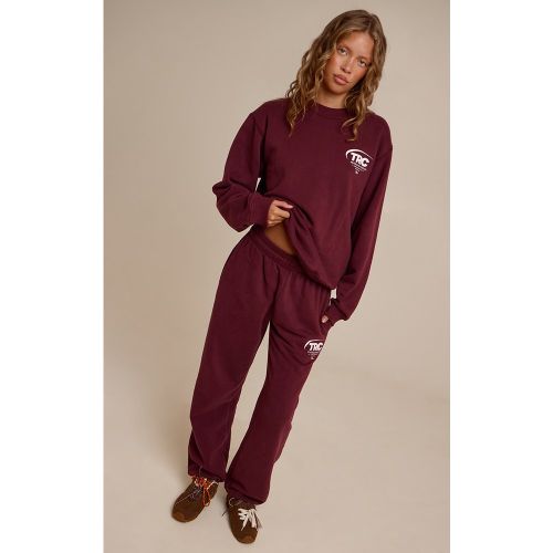 Pantalon de survêtement en coton polaire imprimé "Run Club" à ourlets resserrés | Taille Large - PrettyLittleThing - Modalova