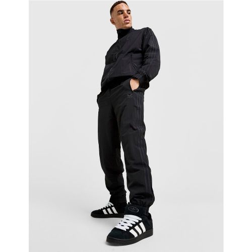 Pantalon de survêtement Firebird Woven - - adidas Originals - Modalova