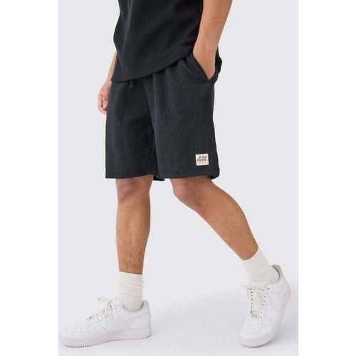 Relaxed Mid Length Textured Short With Woven Tab homme - Boohooman - Modalova