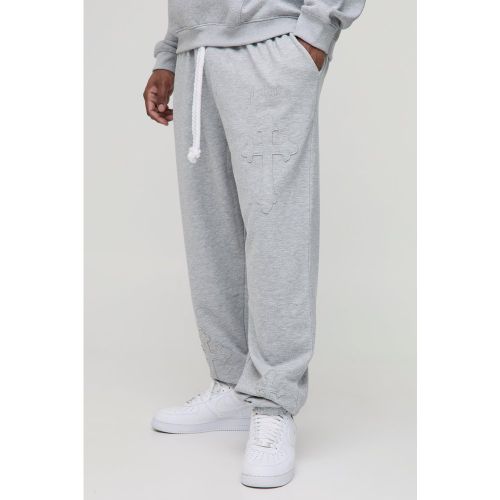 Grande taille - Jogging oversize en corde à écusson croix - 2XL - Boohooman - Modalova