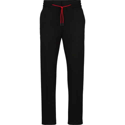 Pantalon Extra Slim Fit en jersey stretch performant avec cordon de serrage - HUGO - Modalova