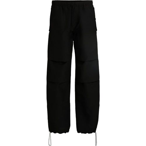 Pantalon ample à doubles plis au niveau des genoux - HUGO - Modalova