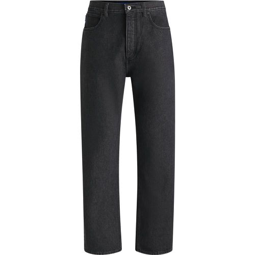 Jean Baggy en denim noir stone-washed - HUGO - Modalova