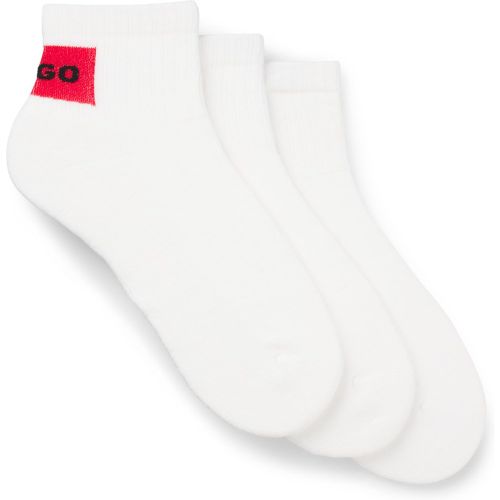 Lot de trois paires de chaussettes basses avec étiquettes logotées rouges - HUGO - Modalova