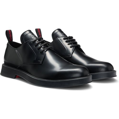 Chaussures derby en cuir avec languette à logo revisité - HUGO - Modalova