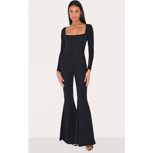 Black Combinaison Côtelée À Jambes Évasées Avec Manches Longues Et Finitions En Dentelle | Taille 42 - PrettyLittleThing - Modalova