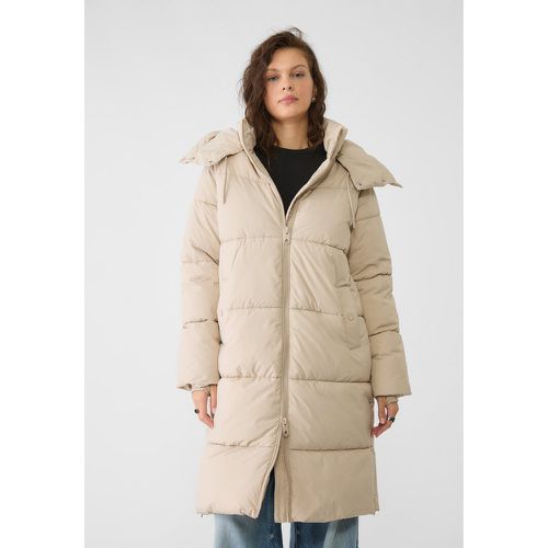 Manteau matelassé long à capuche Écru XS - Stradivarius - Modalova