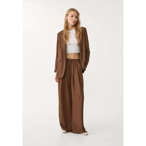 Pantalon fluide à pinces texturé XS - Stradivarius - Modalova