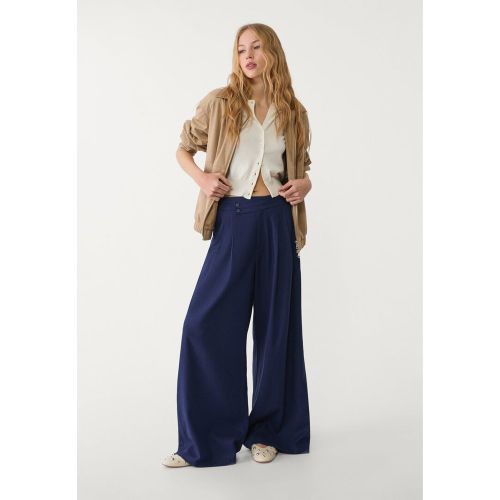 Pantalon fluide à pinces en lin mélangé 32 - Stradivarius - Modalova