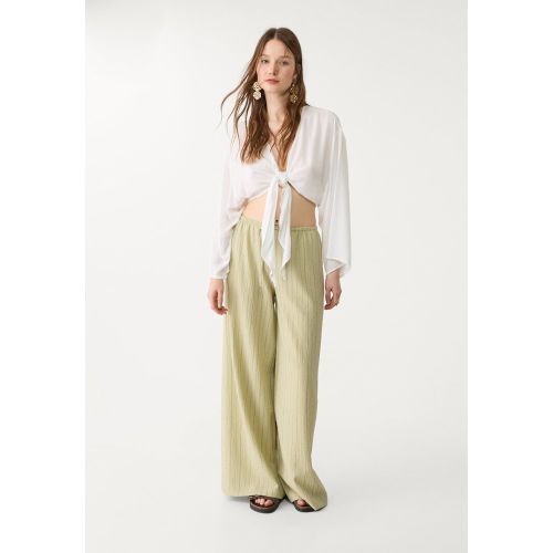 Blouse fluide à nœud XS - Stradivarius - Modalova