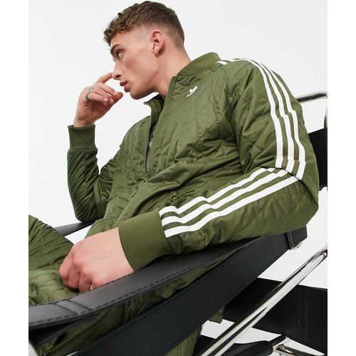 Adicolor - Veste de survêtement matelassée à trois bandes - Kaki - adidas Originals - Modalova