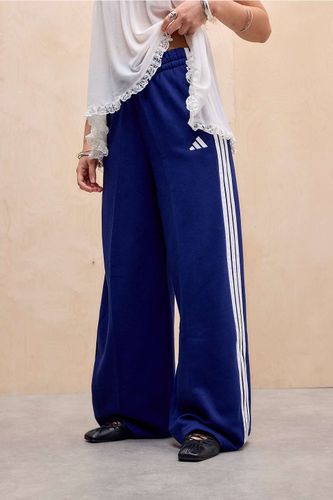 Pantalon de survêtement à jambes larges et 3 bandes taille: XS - adidas - Modalova