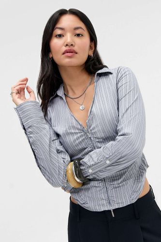 Chemise ajustée Zippy UO par en taille: Small - Urban Outfitters - Modalova