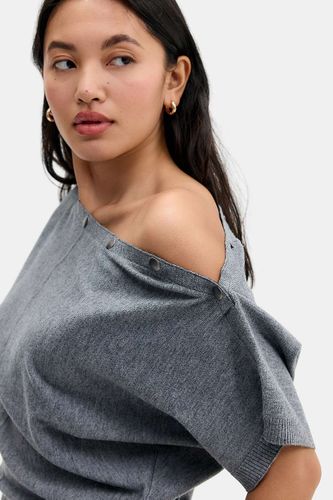 Haut manches chauve-souris courtes à boutons pression UO par en taille: XS - Urban Outfitters - Modalova