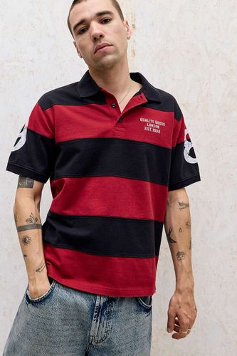 Chemise polo rugby à rayures rouges et marine en taille: Medium - BDG - Modalova