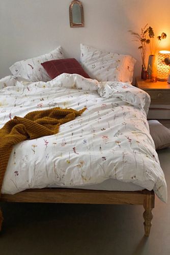 Housse de couette Florence à fleurs pressées avec sac en tissu réutilisable - Urban Outfitters - Modalova