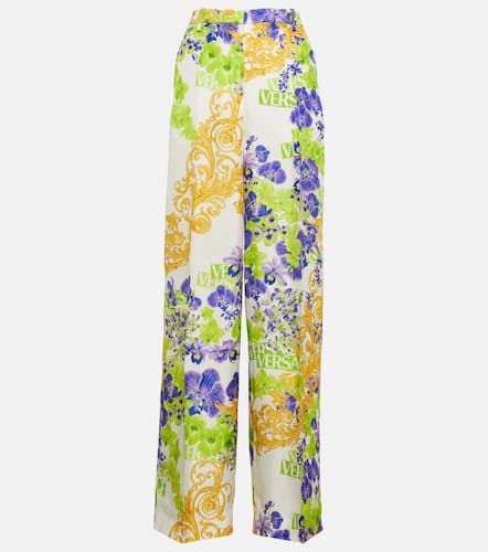 Versace Pantalon ample à fleurs - Versace - Modalova