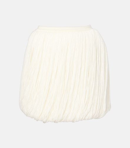 Alaïa Mini-jupe en laine à franges - Alaia - Modalova