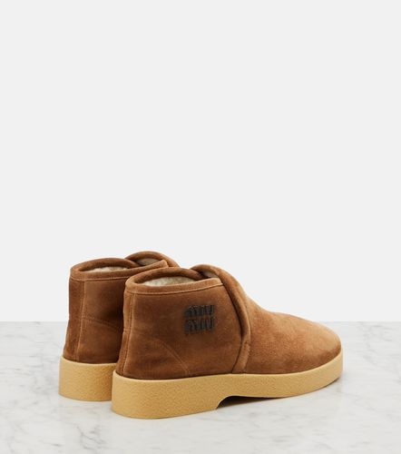 Miu Miu Bottes en daim et shearling - Miu Miu - Modalova
