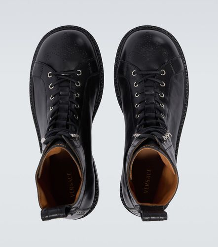 Bottines Billy en cuir perforé - Versace - Modalova
