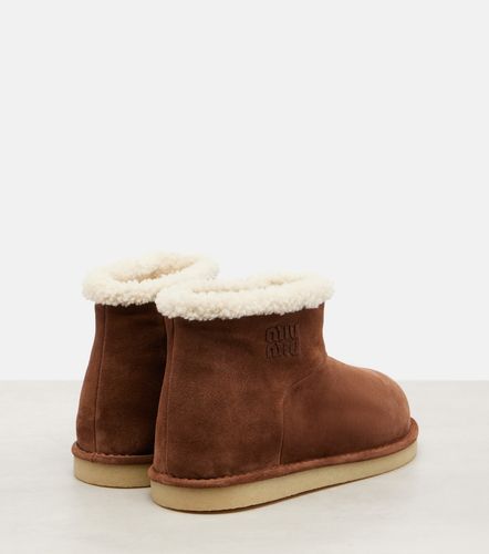 Bottines en daim et shearling - Miu Miu - Modalova