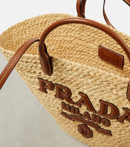 Sac panier en raphia bordé de cuir - Prada - Modalova