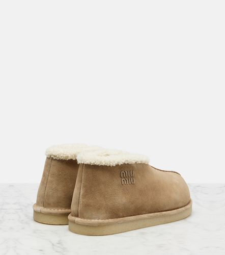 Bottines en daim et shearling - Miu Miu - Modalova