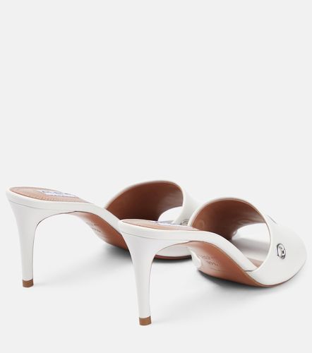 Alaïa Mules Œillets en cuir à ornements - Alaia - Modalova