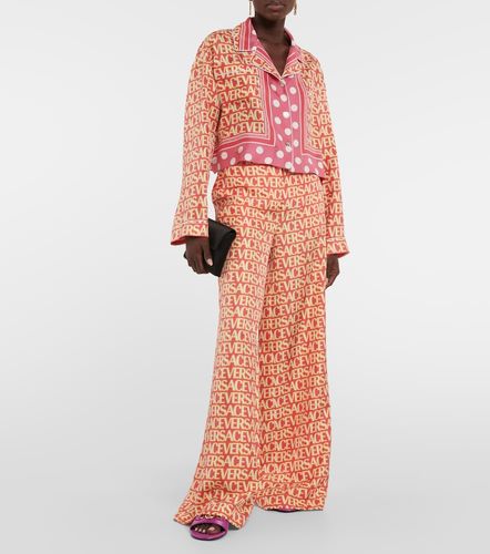 Pantalon ample Allover en soie - Versace - Modalova