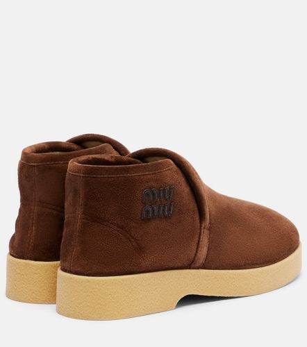 Bottines en daim et shearling - Miu Miu - Modalova