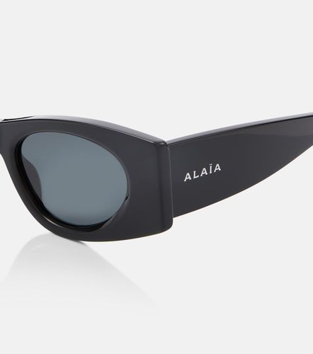 Alaïa Lunettes de soleil ovales à logo - Alaia - Modalova