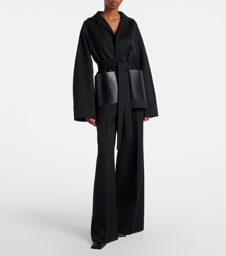 Alaïa Pantalon ample en laine vierge et cuir - Alaia - Modalova