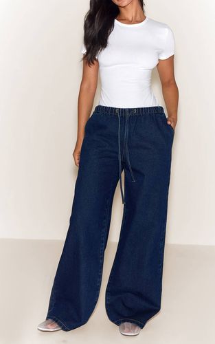 Mid Blue Wash Jean Large Taille Haute Élastiquée Avec Lien En Denim Petite | Taille 32 - PrettyLittleThing - Modalova