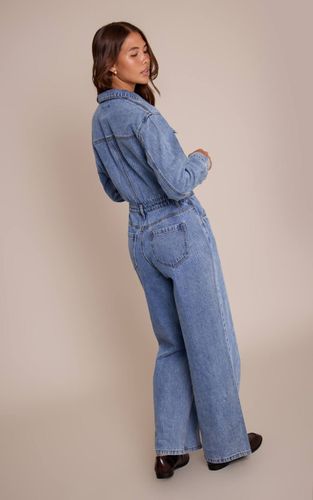 Mid Blue Wash Combinaison En Denim À Manches Longues Avec Surpiqûres Contrastantes | Taille 32 - PrettyLittleThing - Modalova