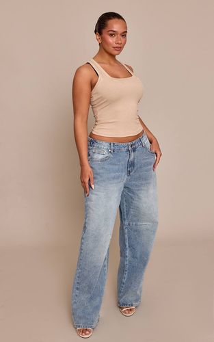 Mid Blue Wash Jean En Denim Shape Bleu Moyen Taille Échancrée Ajusteurs Latéraux Jambe Baril | Taille 34 - PrettyLittleThing - Modalova
