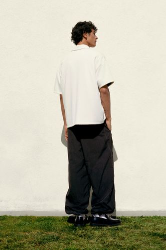 Polo Interlock Graphique Zippé - Pull&Bear - Modalova